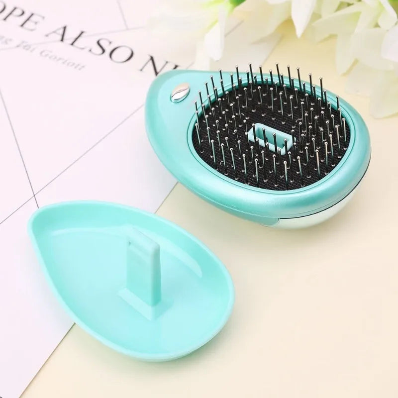 Pink electric sound wave vibration magnetic massage comb with ergonomic handle and negative ion function