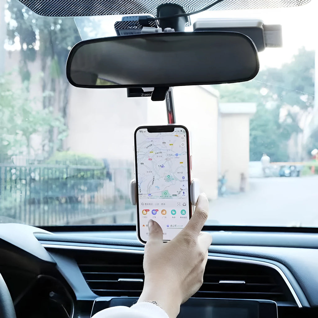 Black ABS plastic mobile phone bracket mounted on car rearview mirror showing smartphone in holder