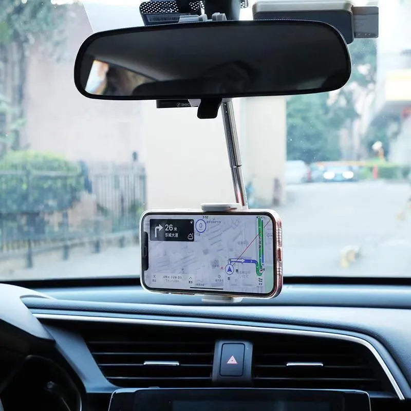 Black ABS plastic mobile phone bracket mounted on car rearview mirror showing smartphone in holder