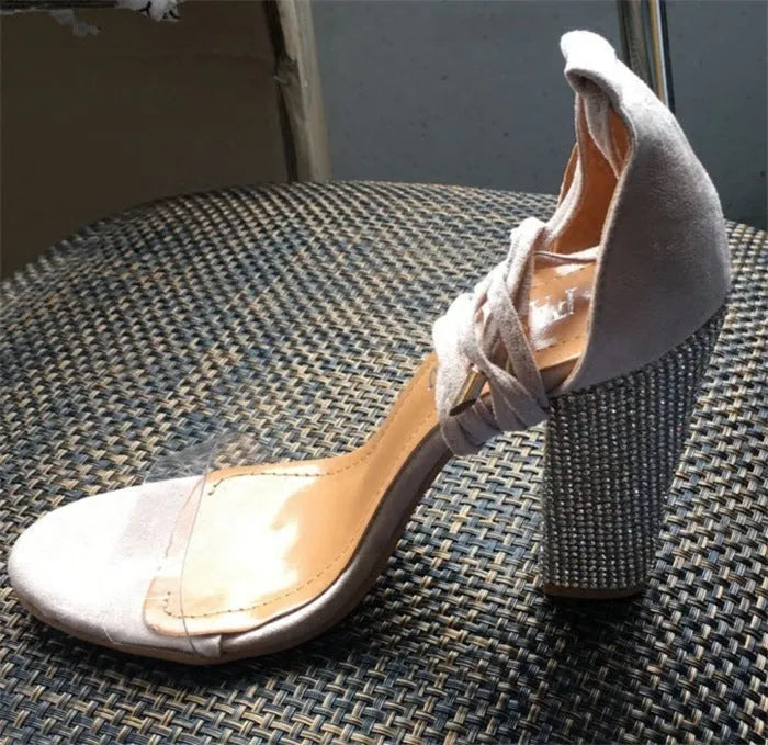Plastic high heel shoes with pointed toe in black and gold colours
