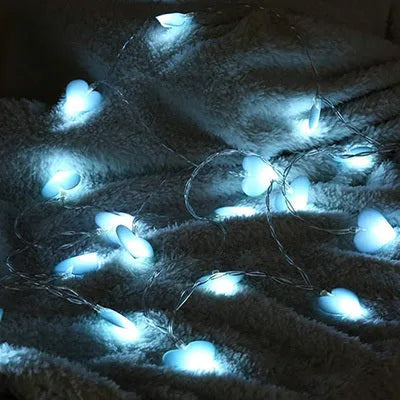 3-metre battery-powered love heart LED fairy string lights in pink and purple for bedroom decoration