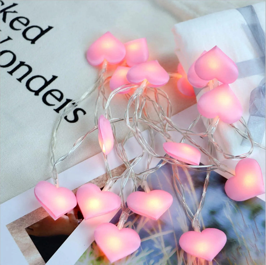 3-metre battery-powered love heart LED fairy string lights in pink and purple for bedroom decoration