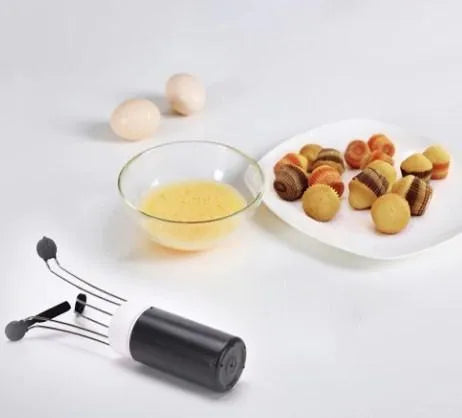 White and black wireless stir crazy mixer with stainless steel shaft on a kitchen countertop