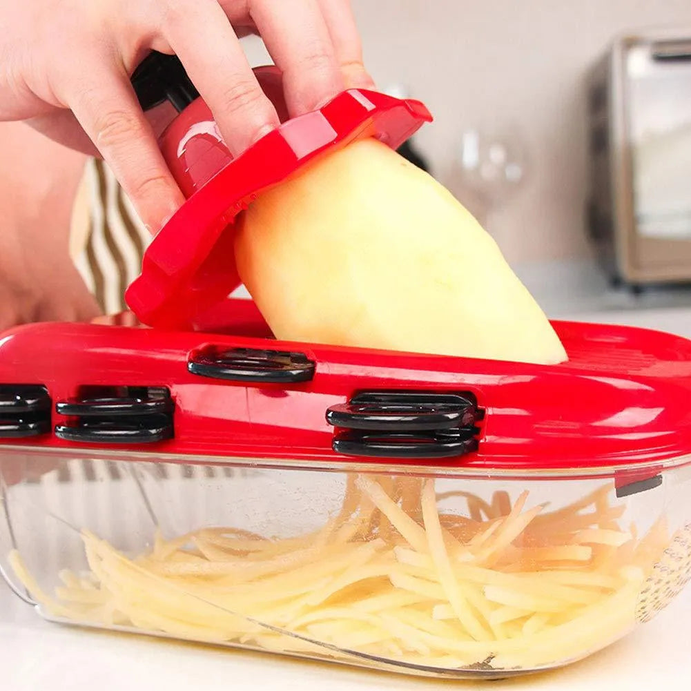 Red multifunctional vegetable cutter set with 7 stainless steel blades and hand guard on a white background