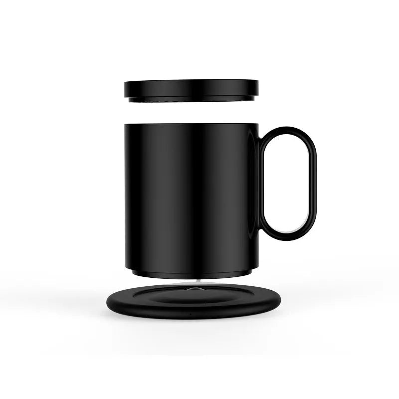 Wireless charging warm coaster in black porcelain with a cup placed on top, showing USB cable