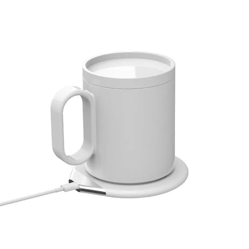 Wireless charging warm coaster in black porcelain with a cup placed on top, showing USB cable