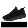 Men's black and white breathable mesh casual jogging sneakers with PVC sole and round toe