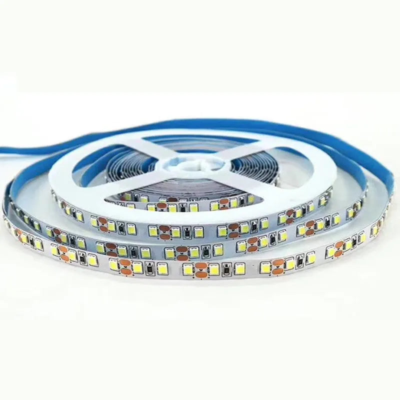 Close-up of a flexible white LED light strip showing dense 2835 or 5050 chips on a rectangular patch-style belt.