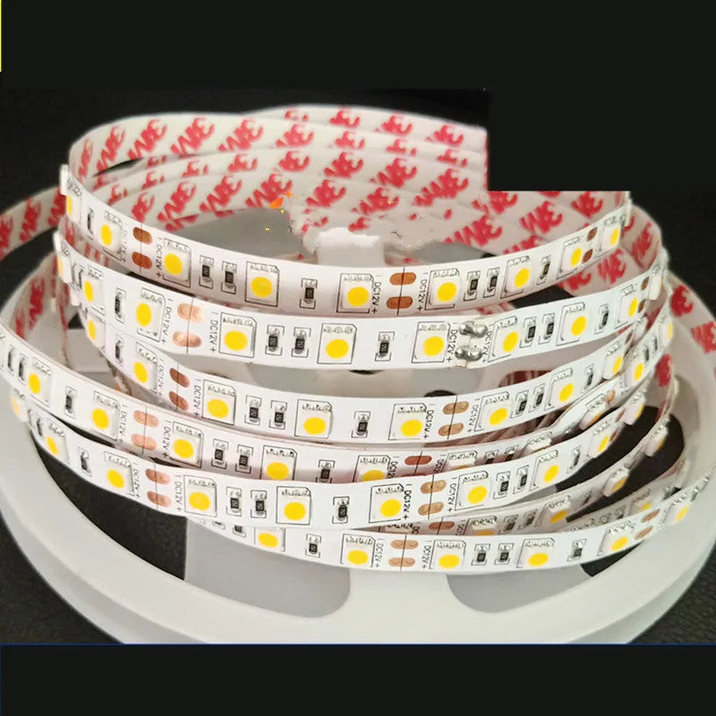 Close-up of a flexible white LED light strip showing dense 2835 or 5050 chips on a rectangular patch-style belt.