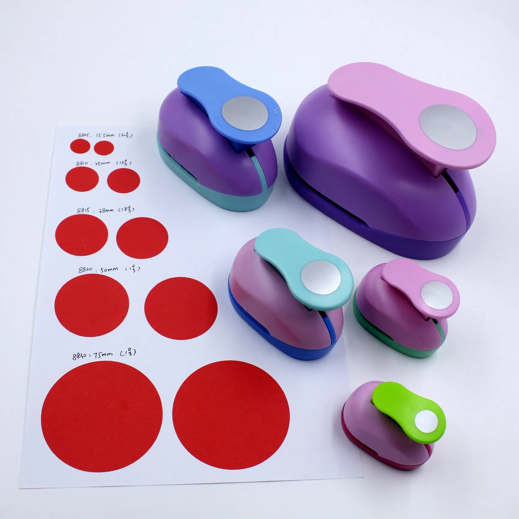 Round children's puzzle embossing machine with colourful finish showing 9mm to 75mm round dies for paper craft