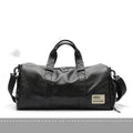 Large black PU leather sports training bag with a single shoulder strap and multiple internal compartments.