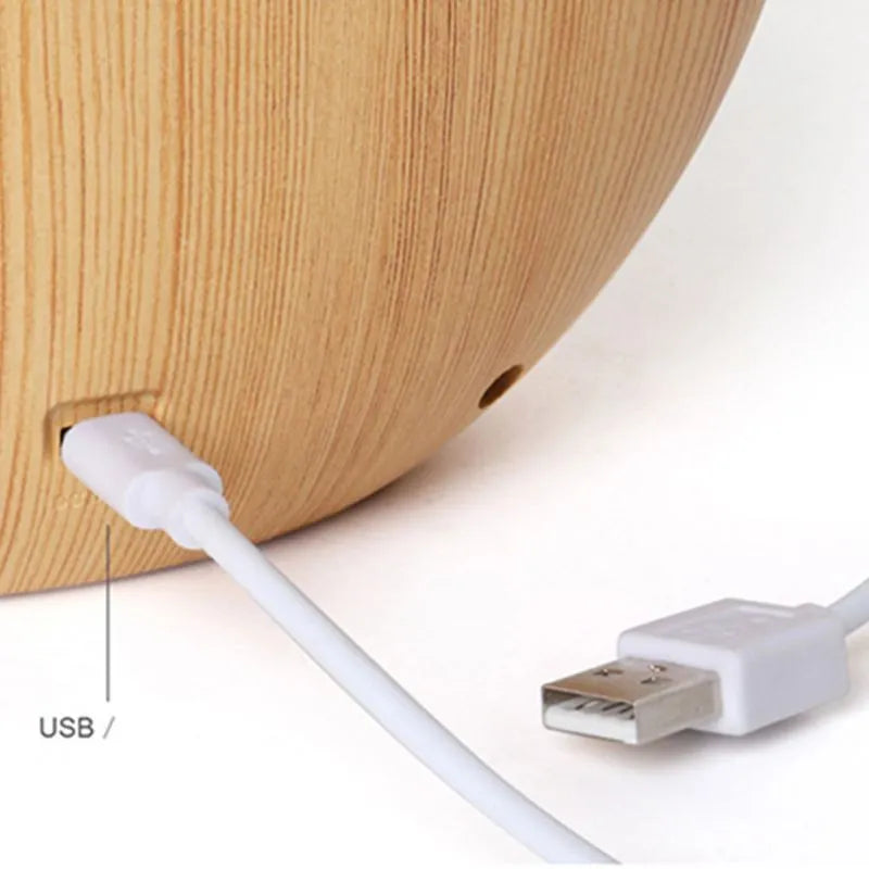 Creative hidden moon light LED touch lamp with ABS shade in blue on a wooden bedside table