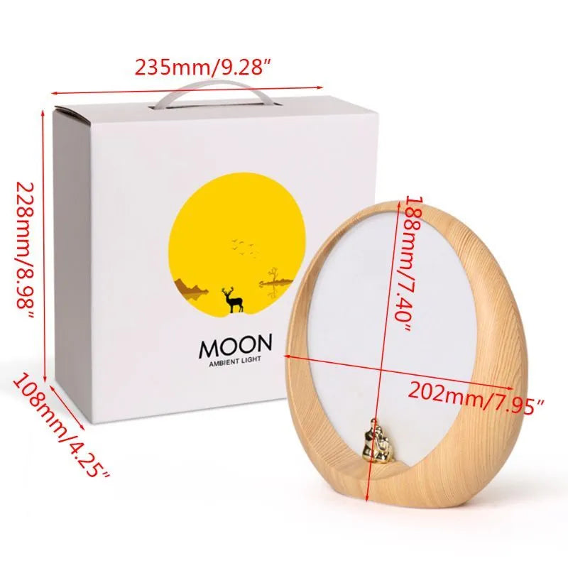 Creative hidden moon light LED touch lamp with ABS shade in blue on a wooden bedside table