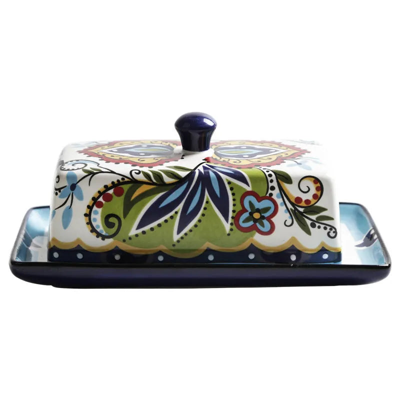 Square ceramic butter box with lid in white, underglaze flower pattern, on kitchen counter