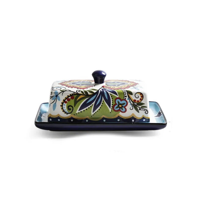 Square ceramic butter box with lid in white, underglaze flower pattern, on kitchen counter