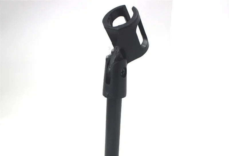 Black metal desktop microphone stand with circular base and plastic clip.