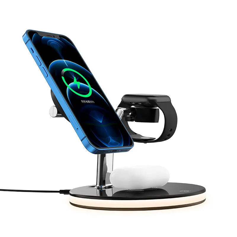 Black 15W three-in-one magnetic wireless charger on a desk with a smartphone placed on the charging pad