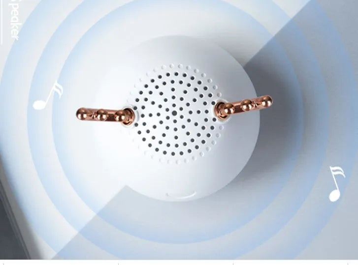 Compact Bluetooth speaker in white, pink, and green, 75x88mm, with USB cable