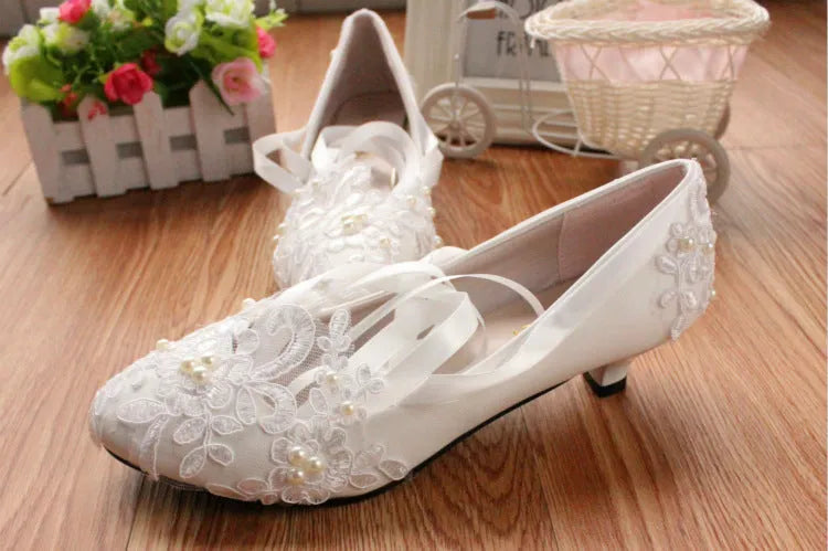 White flat wedding shoes with lace and ribbon trim, low 3cm heel, artificial PU upper