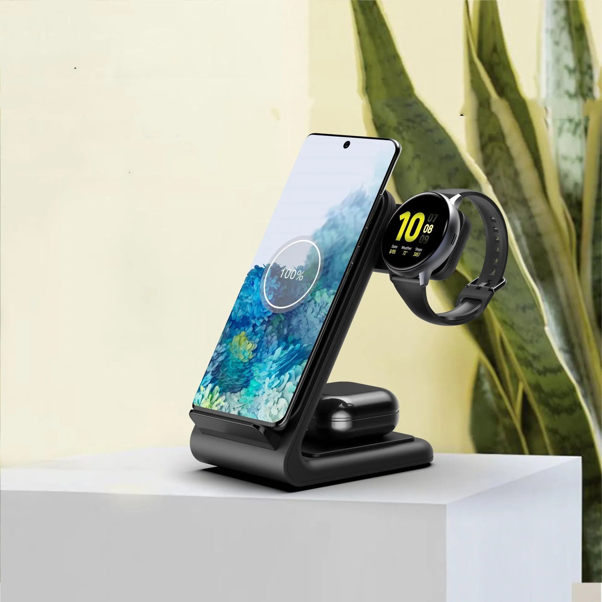 Three-in-one fast wireless charger bracket in black ABS and silicone, holding a phone, smartwatch, and TWS earbuds