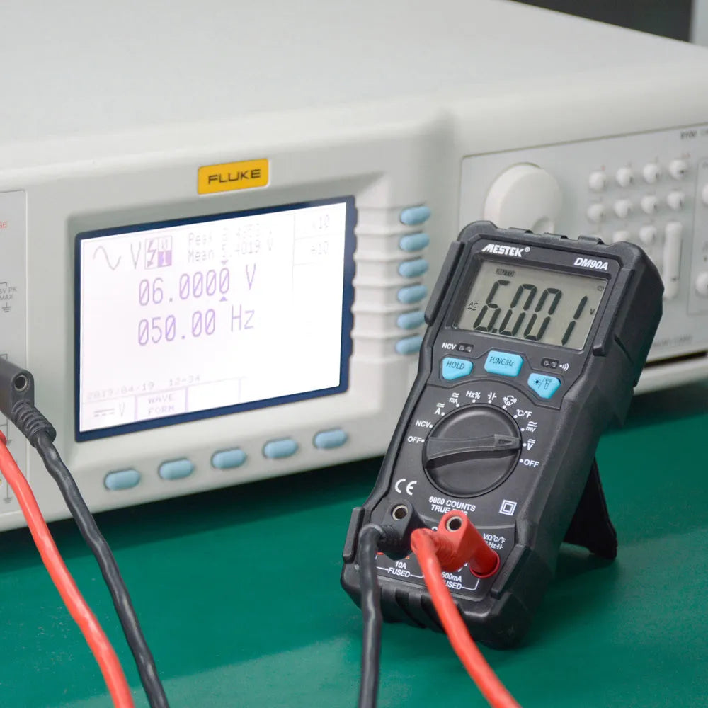 DM90A digital multimeter with display showing measurement, includes test leads for electrical testing