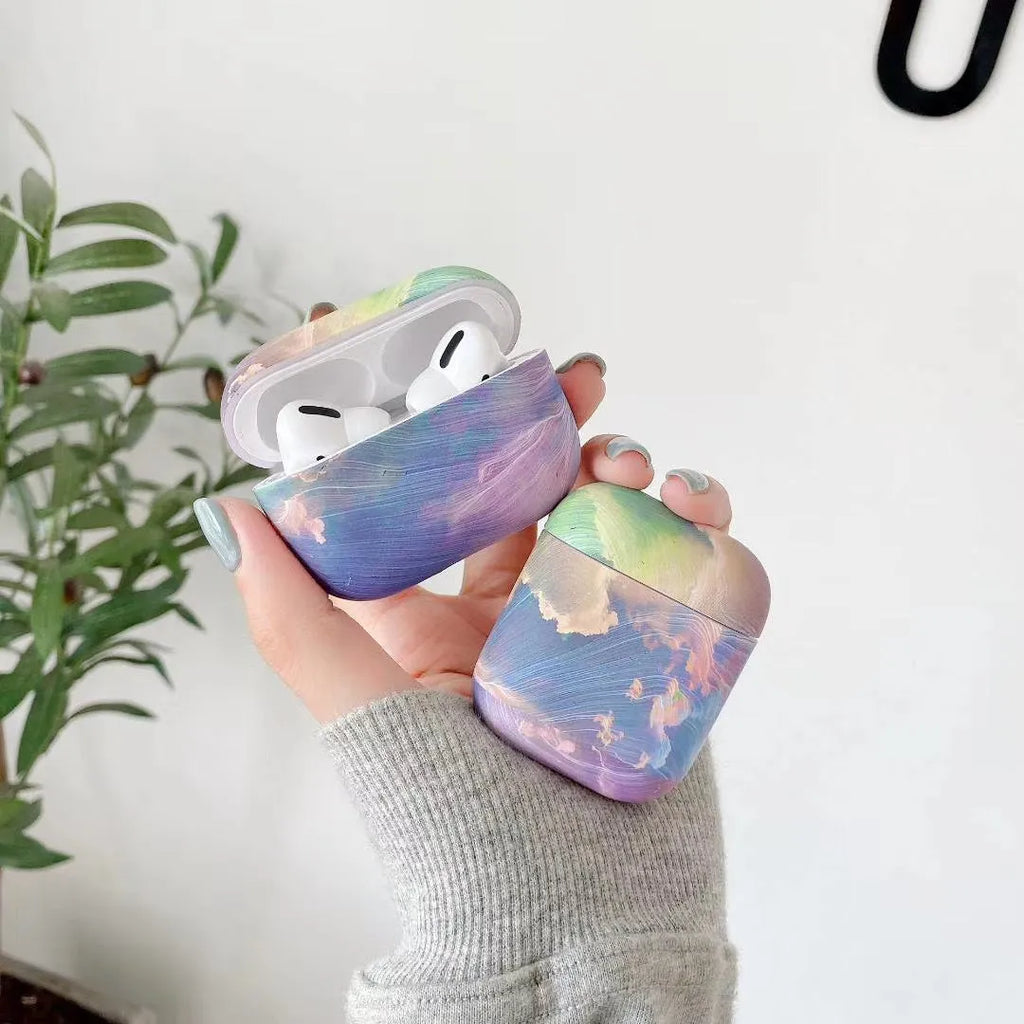 Hard plastic protective case for Apple AirPods with watercolour design in pink or blue options