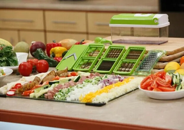 12-piece green hand operated vegetable chopper set with multiple graters and blades on a white background