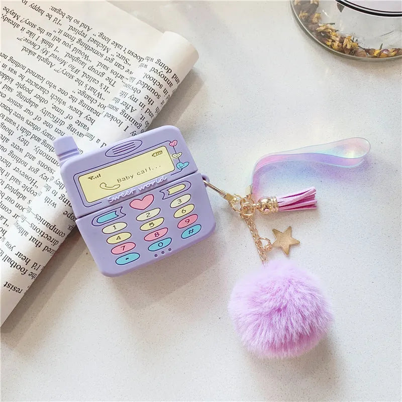 Purple silicone case for Apple wireless headphones with clamshell design and fur ball pendant