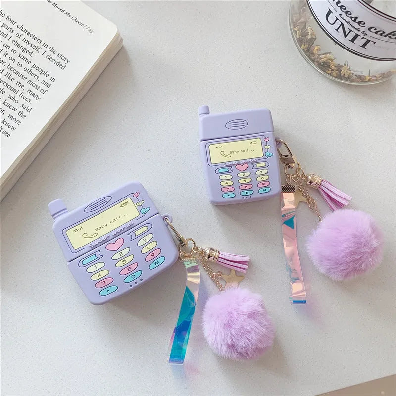 Purple silicone case for Apple wireless headphones with clamshell design and fur ball pendant