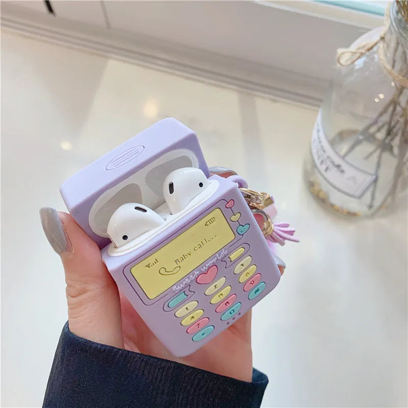 Purple silicone case for Apple wireless headphones with clamshell design and fur ball pendant