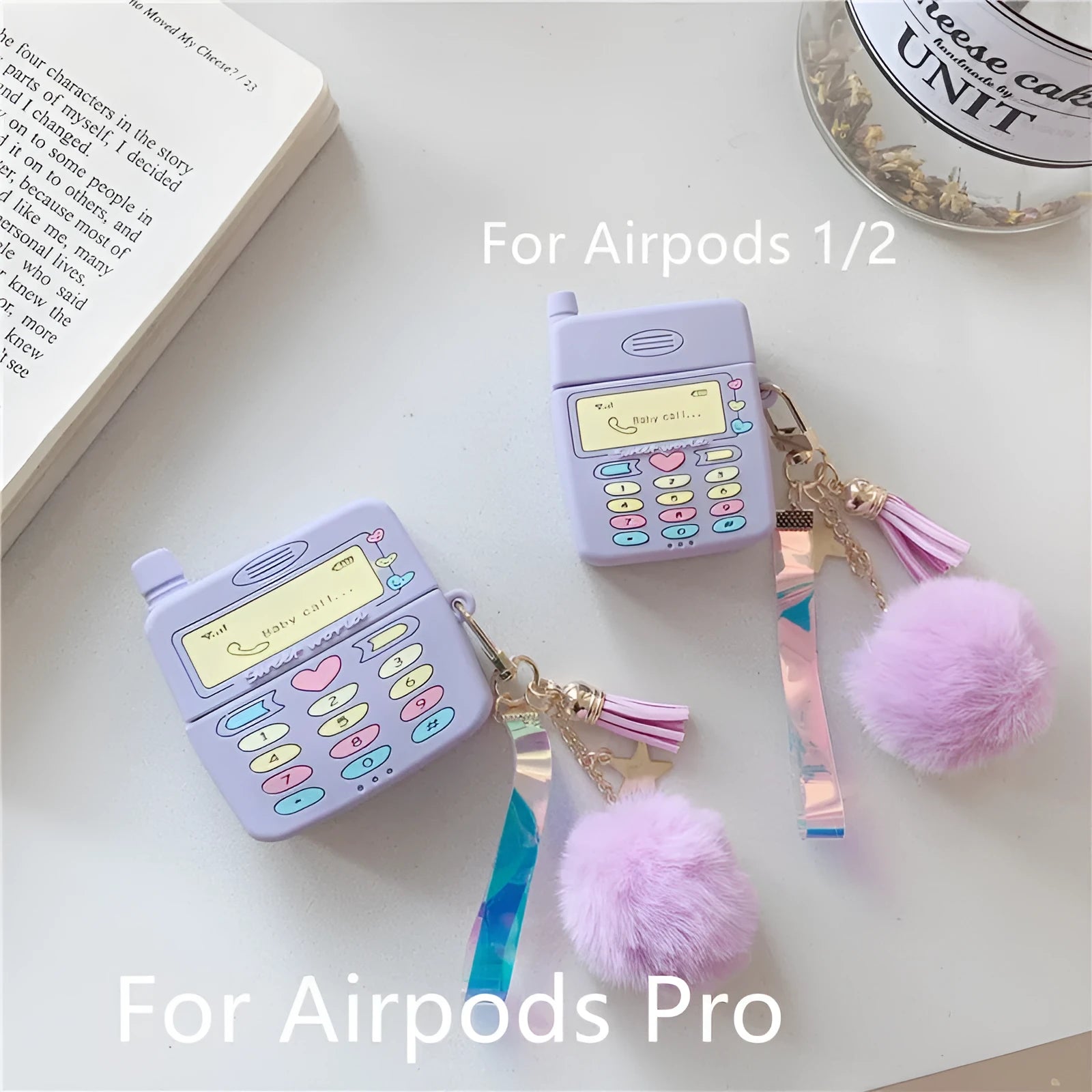 Purple silicone case for Apple wireless headphones with clamshell design and fur ball pendant