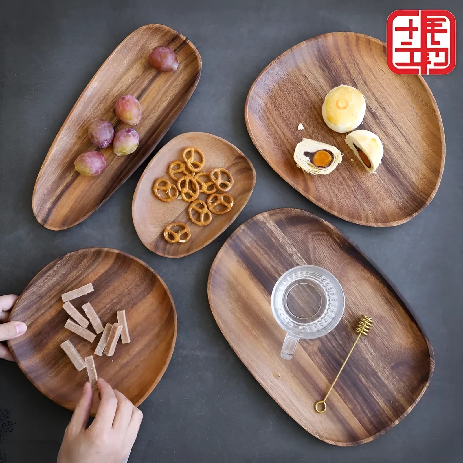 Acacia Japanese snack plate hand-polished natural wood with visible grain and mineral lines on a flat surface