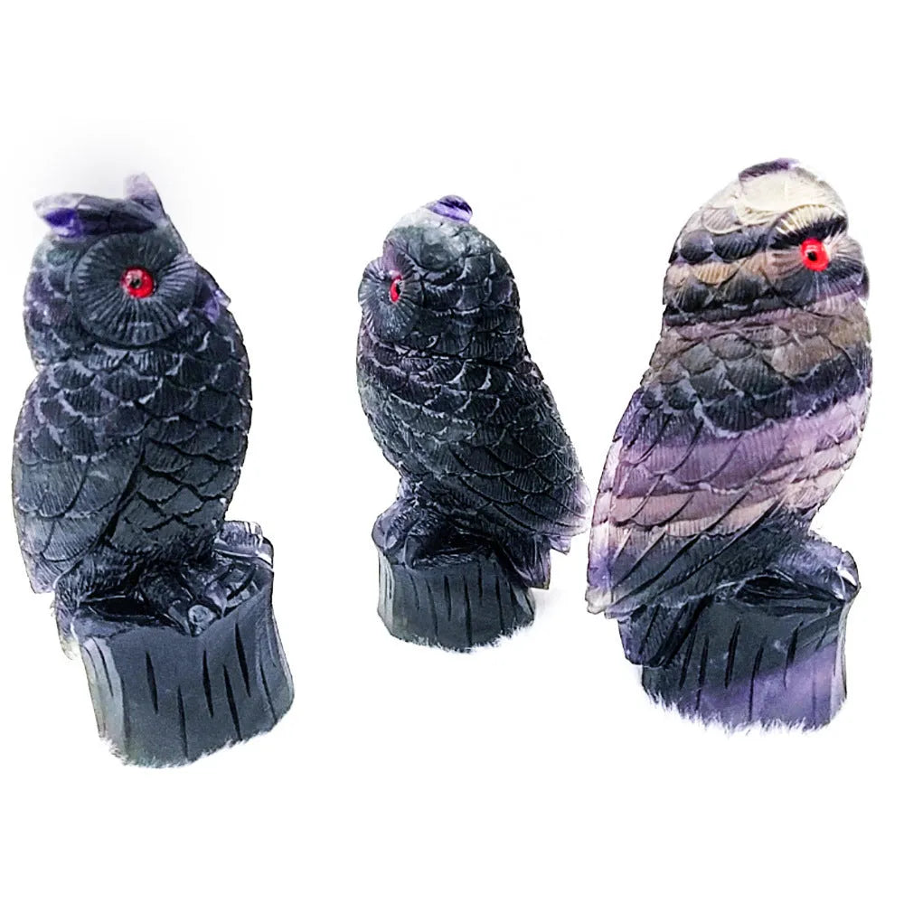 Purple fluorite carved owl ornament showing detailed hand-carved features and natural crystal texture