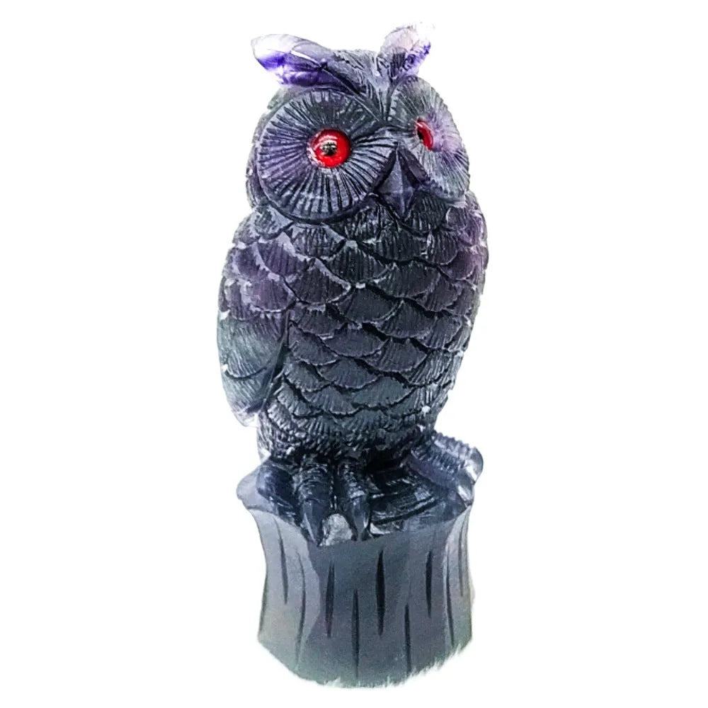 Purple fluorite carved owl ornament showing detailed hand-carved features and natural crystal texture