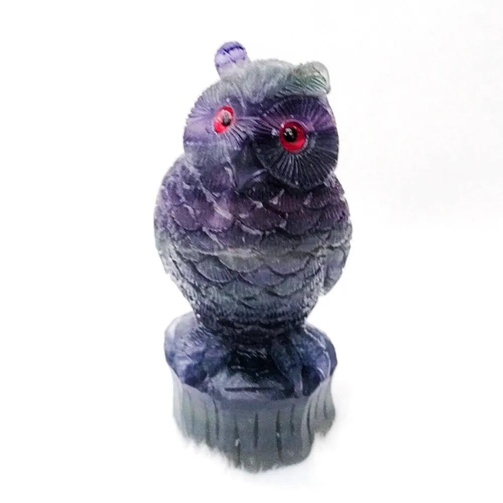 Purple fluorite carved owl ornament showing detailed hand-carved features and natural crystal texture