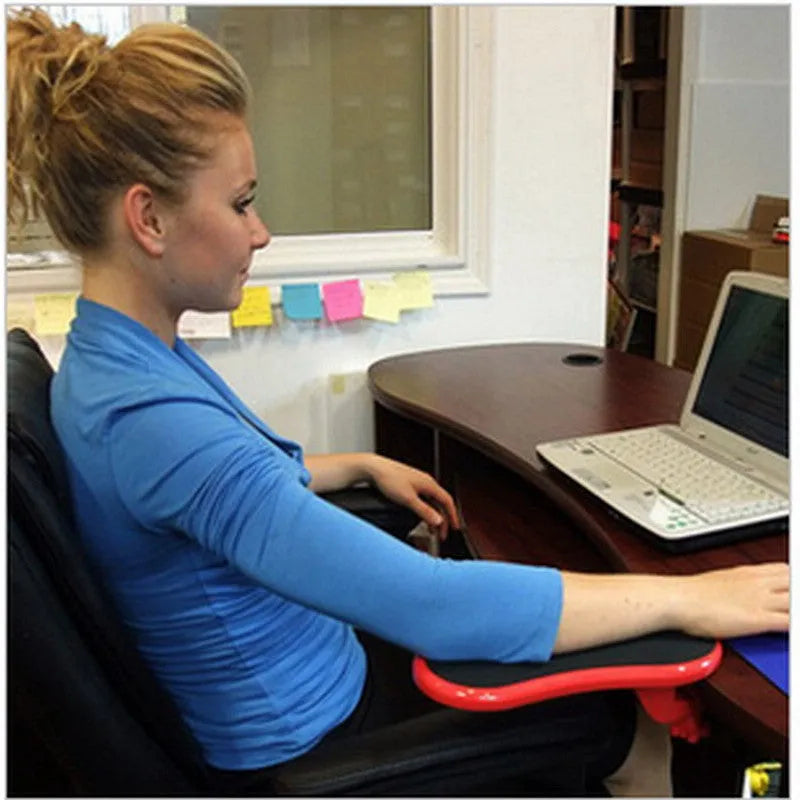 Black rotatable plastic wrist pad with 180-degree hand bracket, 290mm size, on a desk with a keyboard and mouse