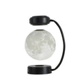 Magnetic levitation moon lamp with 3-colour light changing effect, black elbow base, on a bedside table