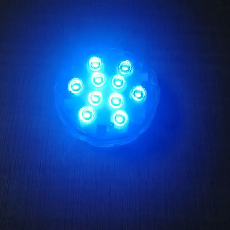 White round waterproof LED light with remote control for pools and ponds.