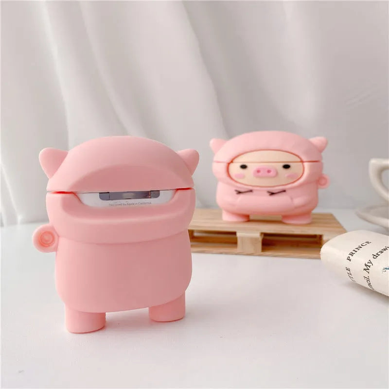 Pink silicone AirPods case cover with cartoon pig design and carrying hook attached