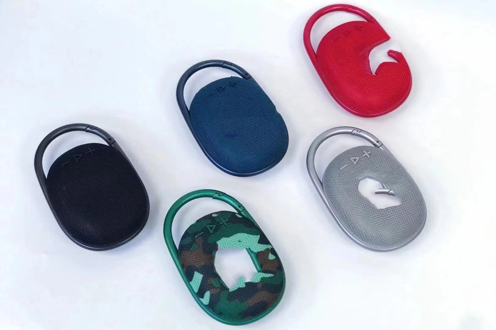 Small portable Bluetooth speaker in one of six colours: pink, blue, black, red, silver grey, or green