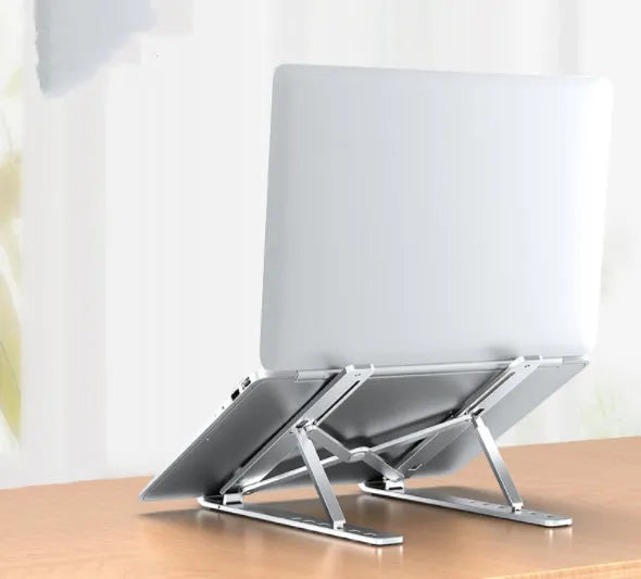 Aluminium alloy folding laptop heightening bracket in black on a desk with a notebook computer placed on top