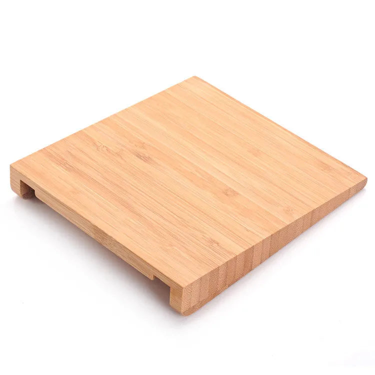 Wooden bamboo bracket for Apple Bluetooth trackpad placed beside an Apple tablet, 15 x 15.8 cm