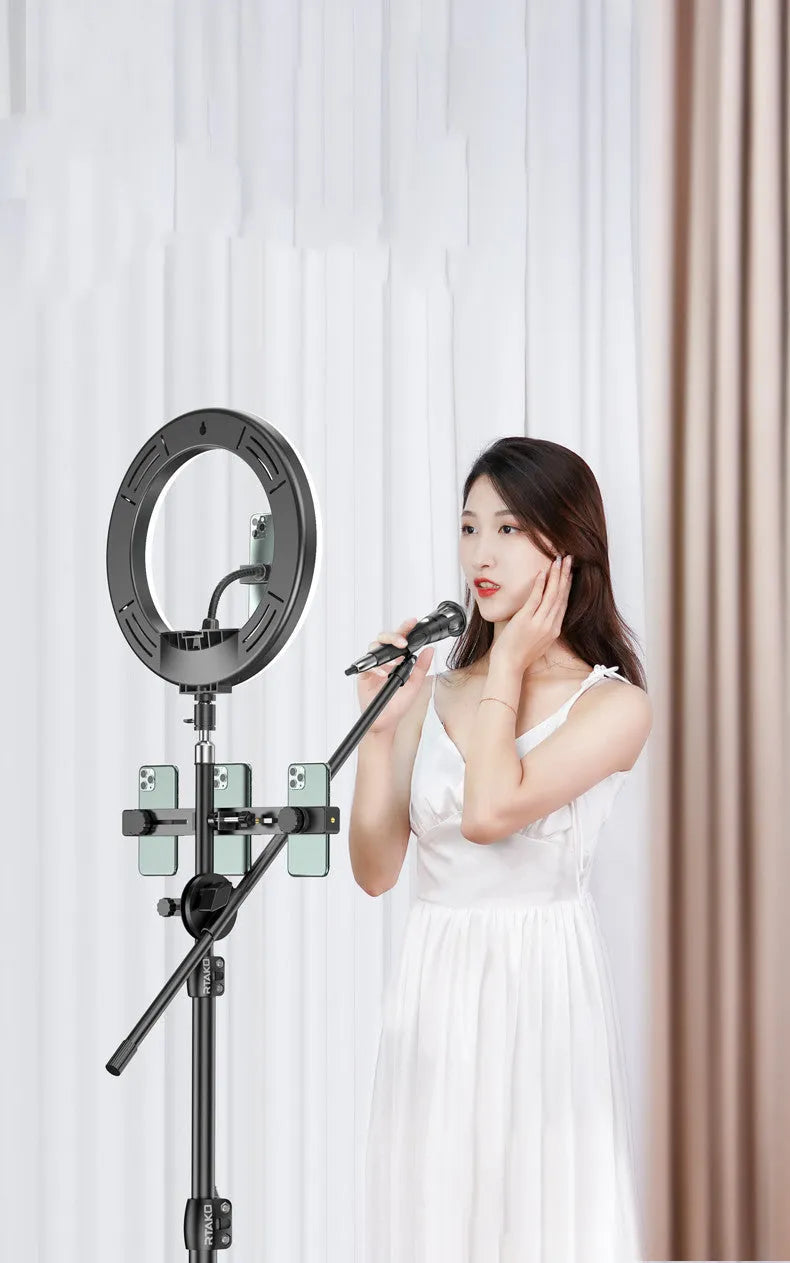 Carbon steel mobile phone tripod with attached light ring, shown at different heights for iPhone content creation