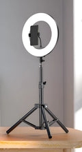Carbon steel mobile phone tripod with attached light ring, shown at different heights for iPhone content creation