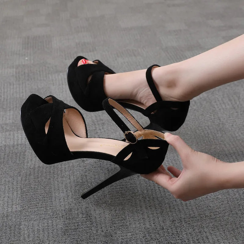 Black women's stiletto sandals with fish mouth toe, Roman style platform, and low heel.