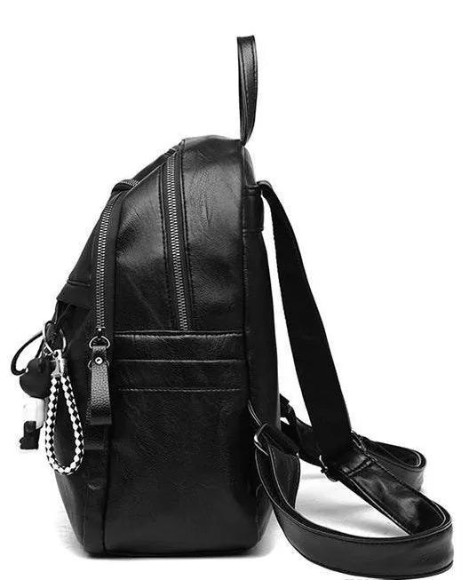 Black PU leather soft surface backpack with double straps showing medium size and organised compartments