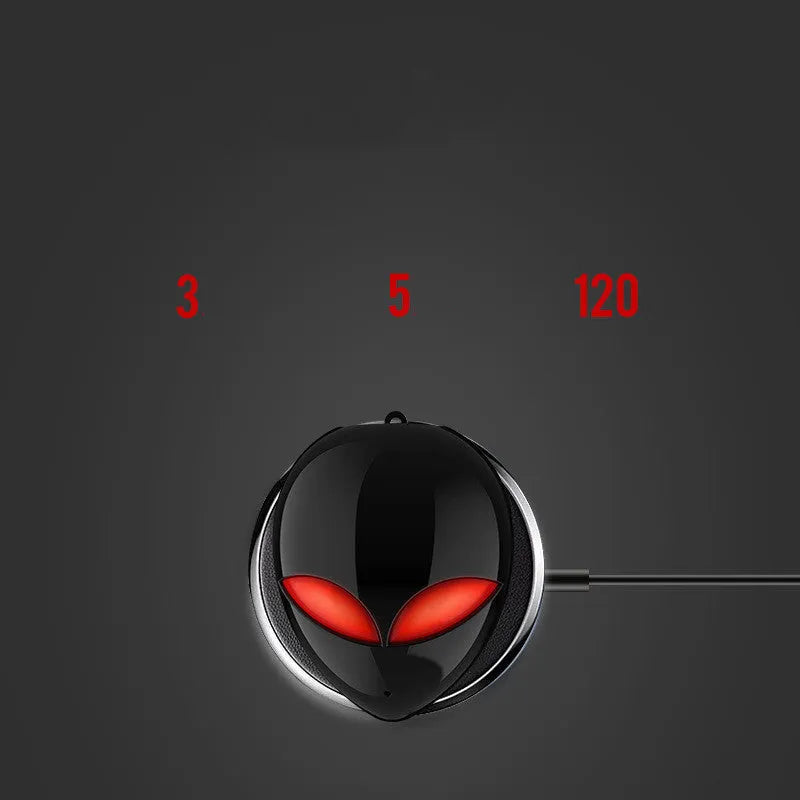 Creative Outer T8 Starman black and white alien design wireless earbuds with LED lights next to charging case.