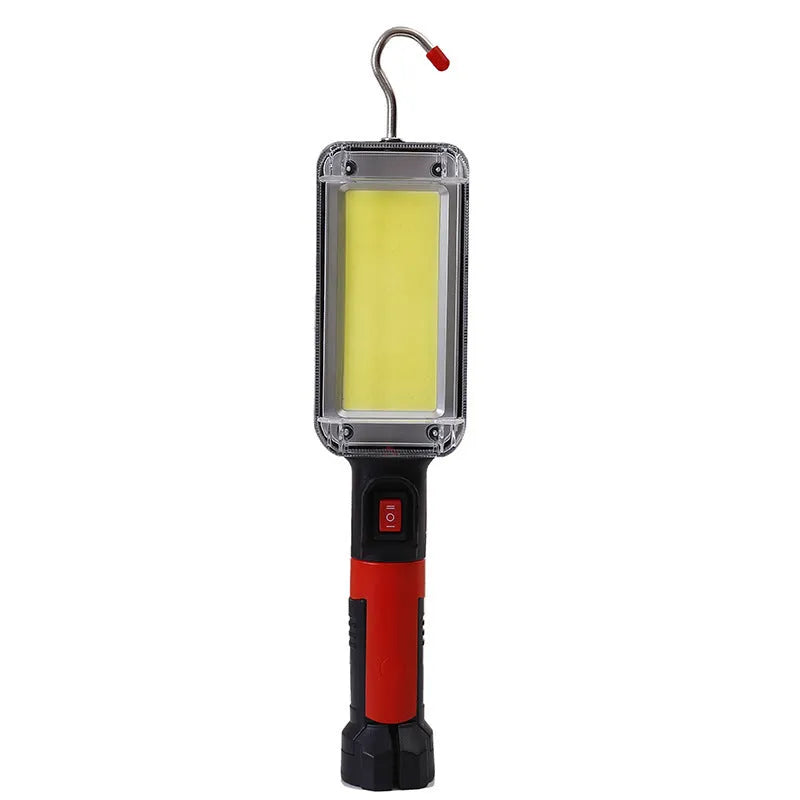 Red portable COB flashlight with magnetic hook showing USB charging port