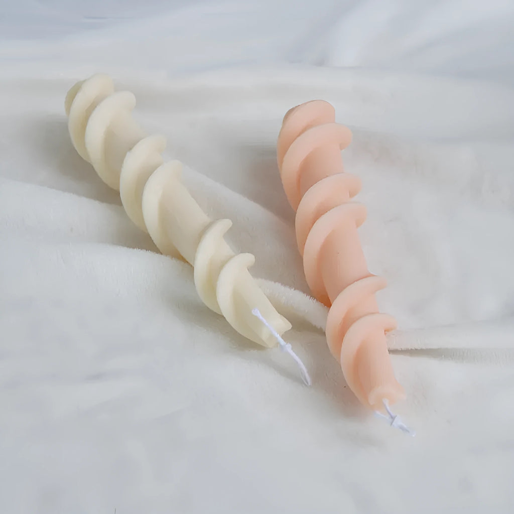 Spiral lace silicone candle mould for creating decorative taper candles with rotating pattern design