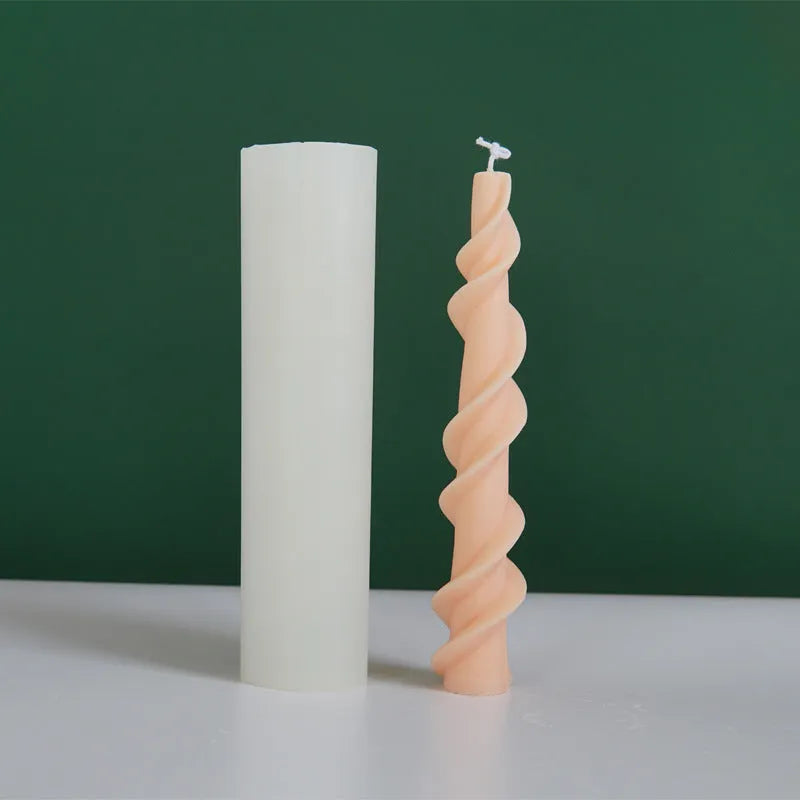 Spiral lace silicone candle mould for creating decorative taper candles with rotating pattern design
